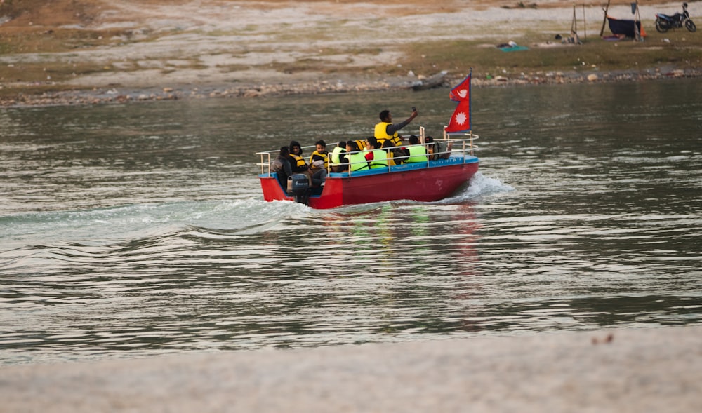 a small boat filled with people on the water