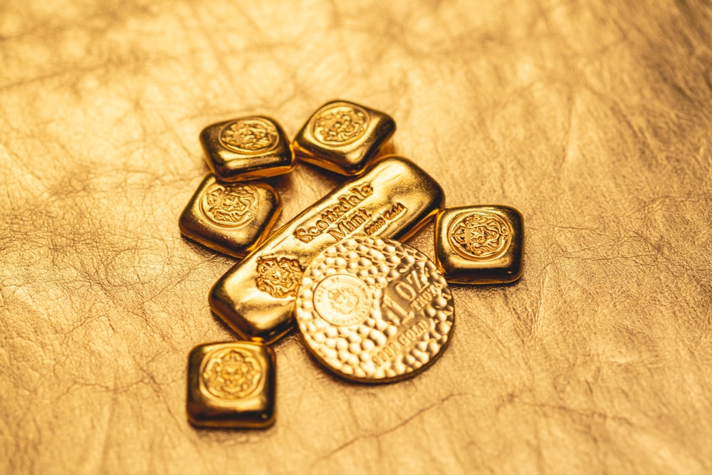 a bunch of gold bars sitting on top of a table