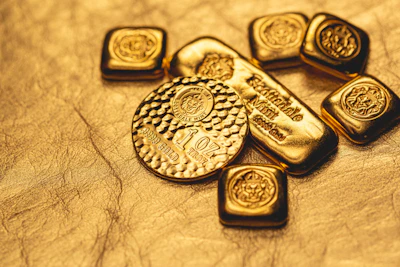 Array of custom gold alloy samples showcasing rich hues from 10k to 18k gold.