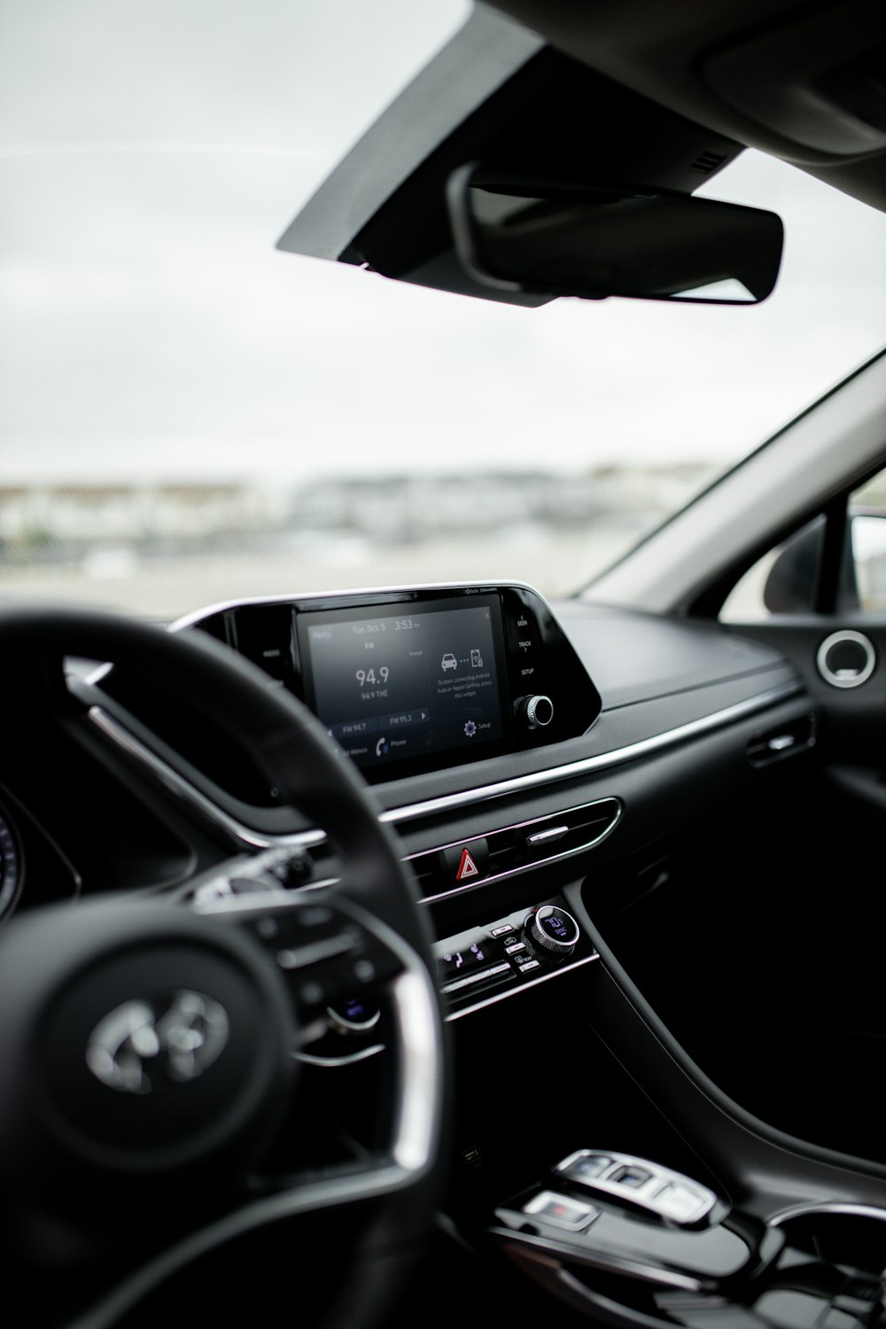 a view of a car dashboard from inside the vehicle