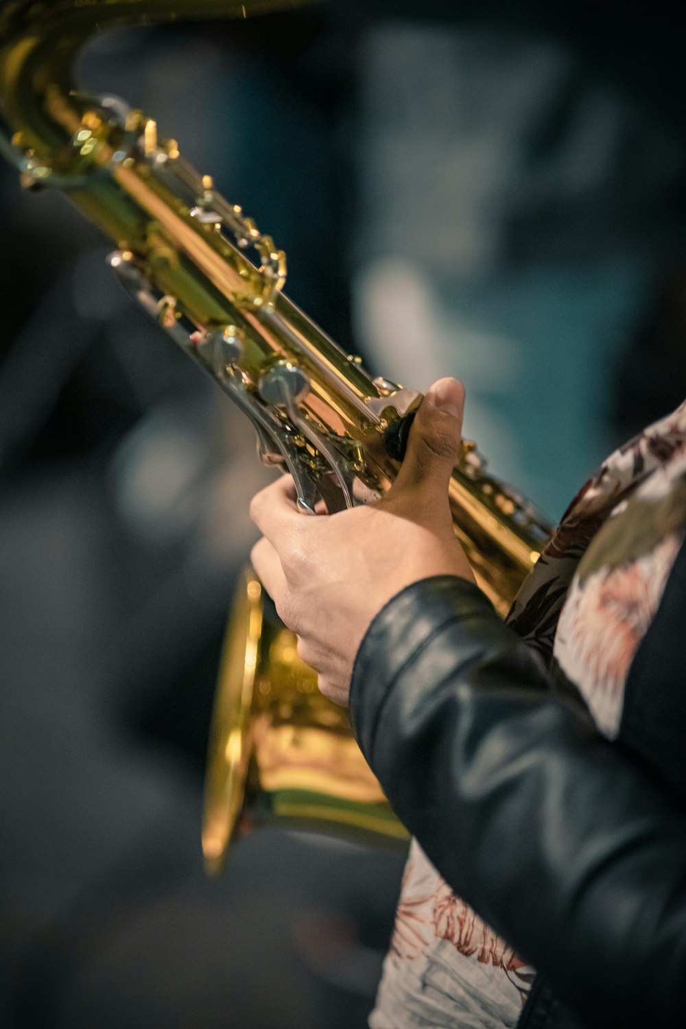 a close up of a person playing a saxophone