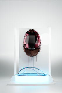 An abstract geometric object, resembling a futuristic helmet, is displayed in the center. The object is made of various metallic and reflective components, primarily black and dark red hues, and is set against a minimalistic backdrop. The object is encased in a transparent glass case with soft ambient lighting illuminating it.