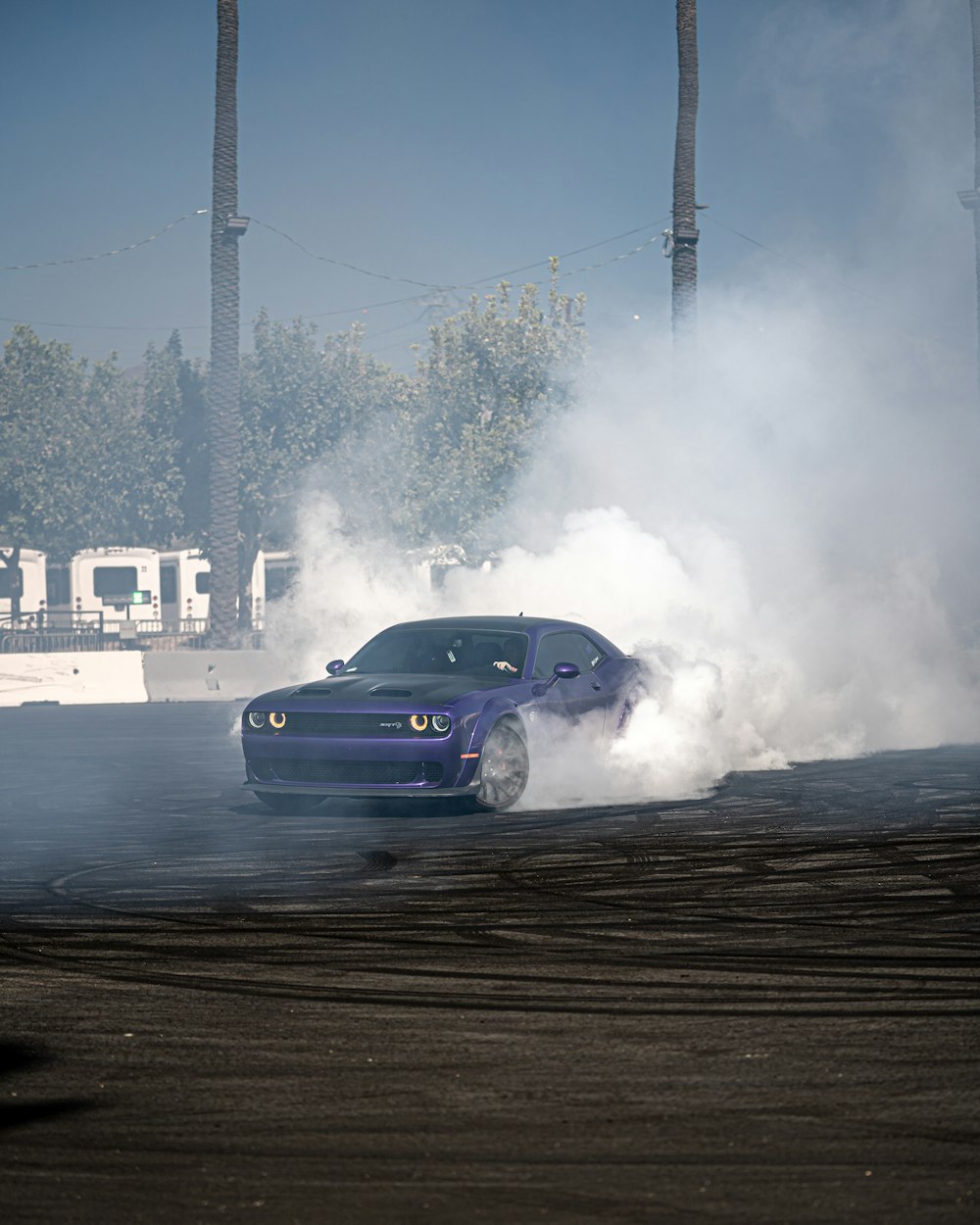 a blue car with a lot of smoke coming out of it