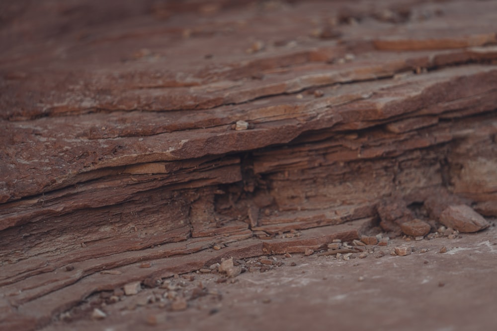 a close up of a rock formation with rocks and dirt