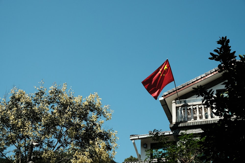a chinese flag flying in front of a house