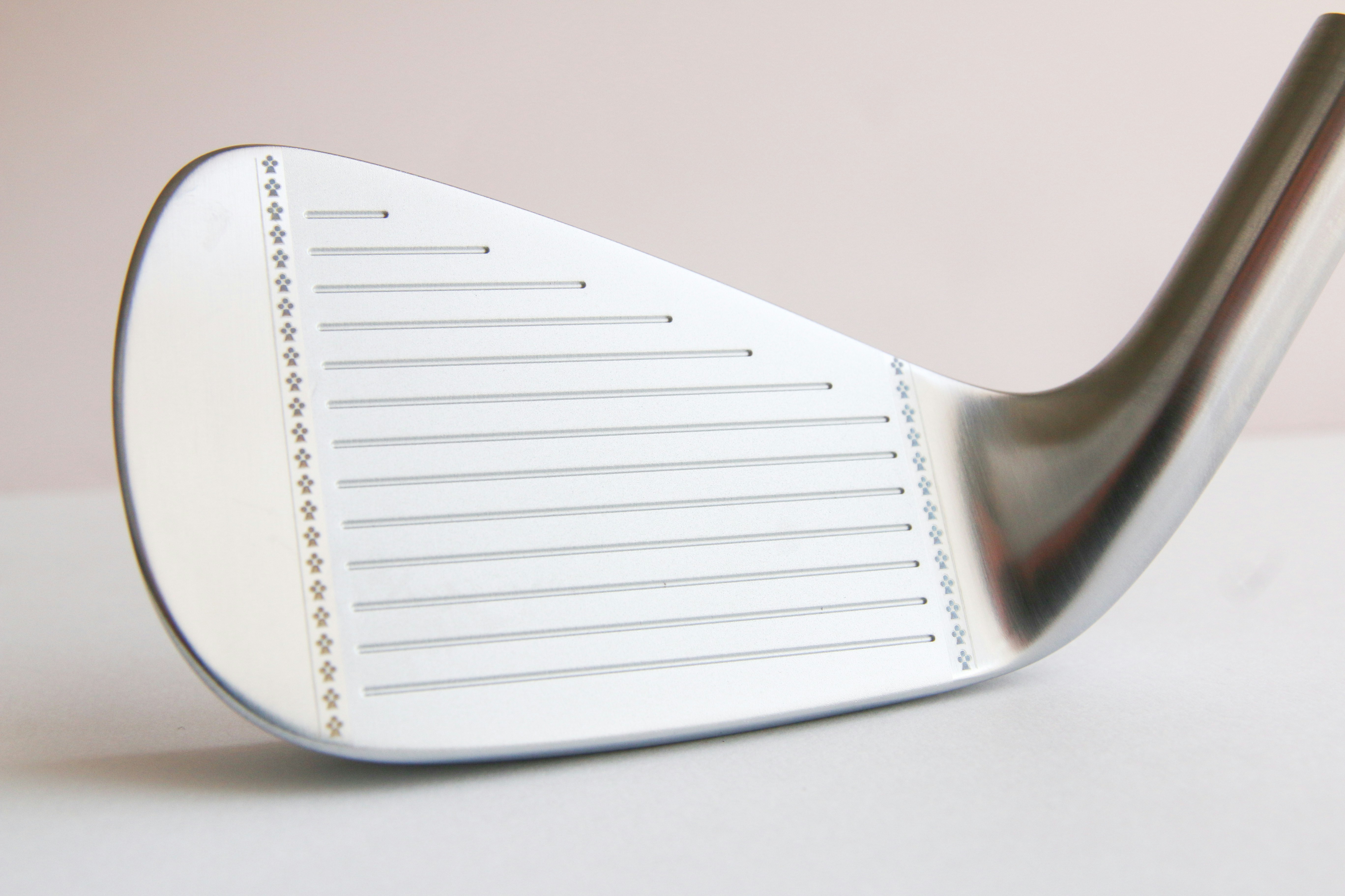 a close up of a golf club on a table