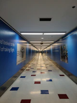 A colorful school corridor decorated with student artwork and inspiring quotes.