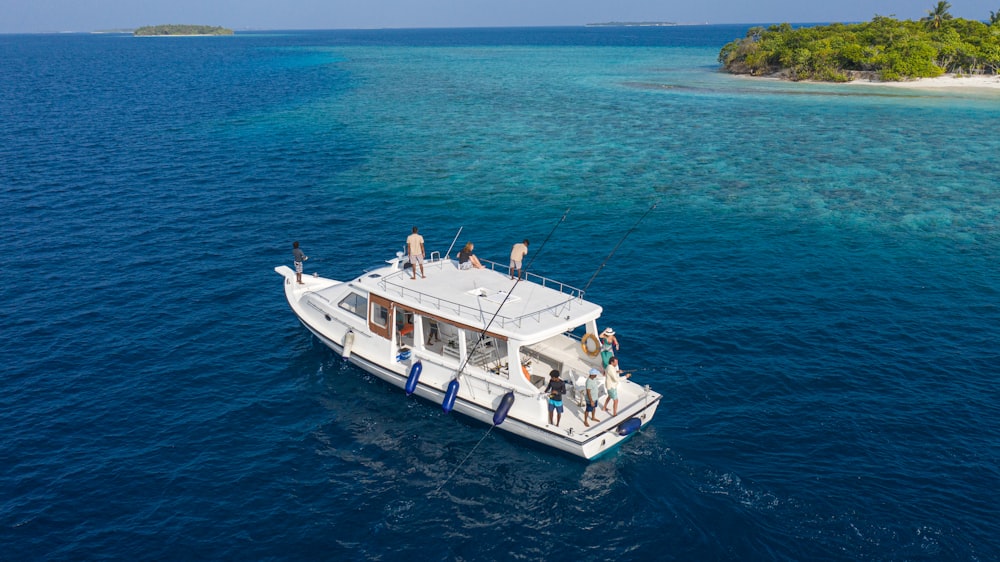 a group of people on a boat in the ocean