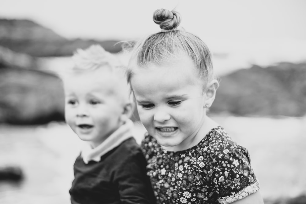 two little girls standing next to each other