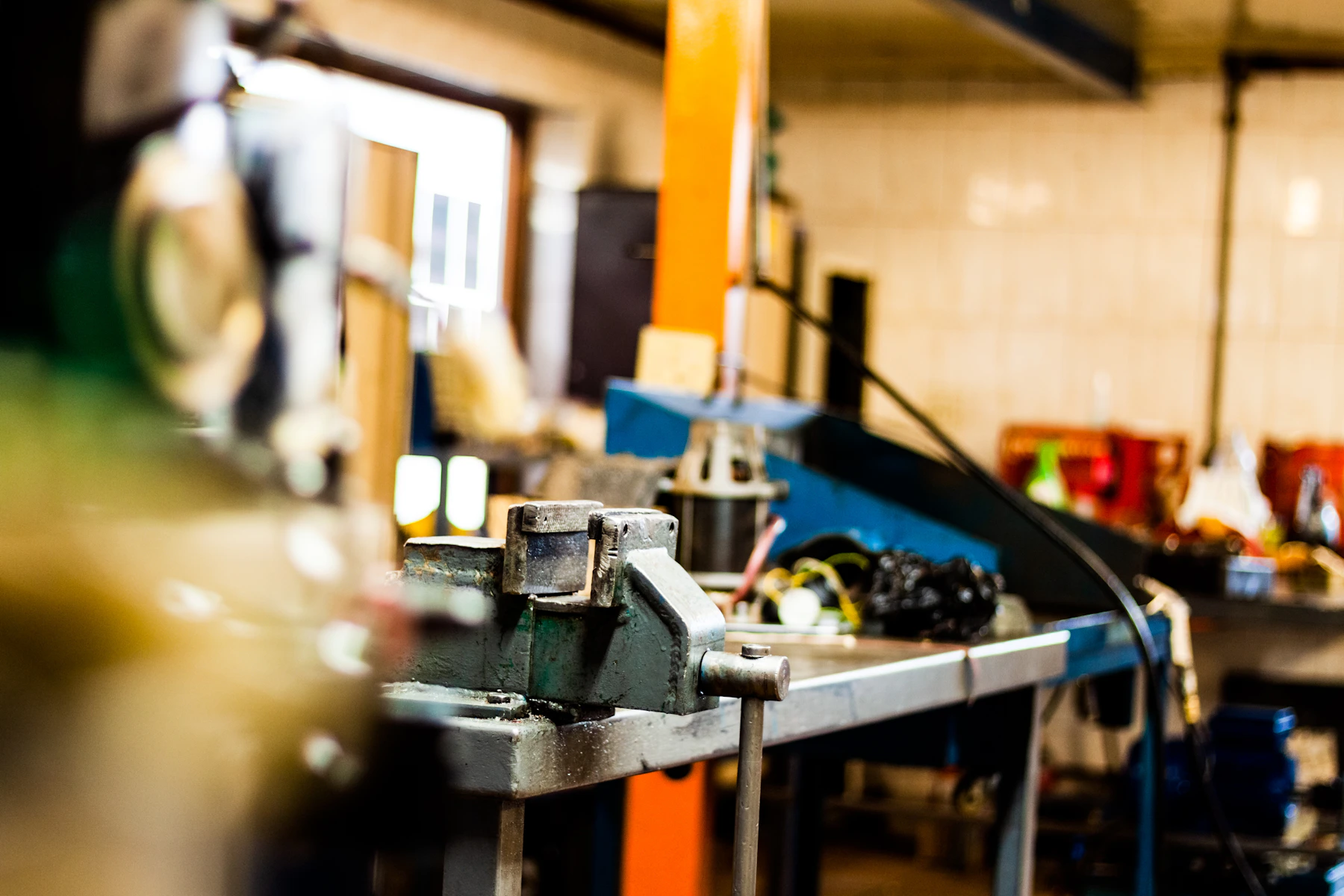 Industrial workbench with tools and workshop equipment