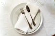 a silver spoon sitting on a table