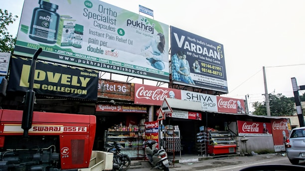 A friendly Ridhi Sidhi Industries representative discussing dealership opportunities with a local business owner.