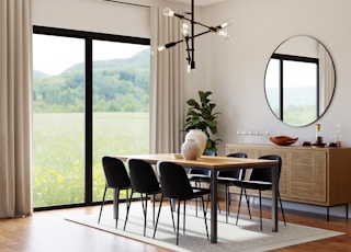 a dining room table in front of a window