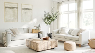 a living room filled with furniture and a large window