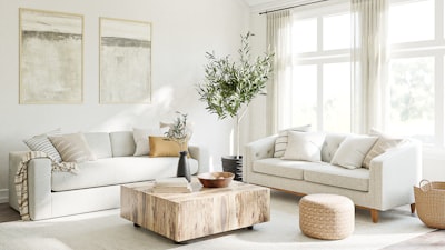 a living room filled with furniture and a large window