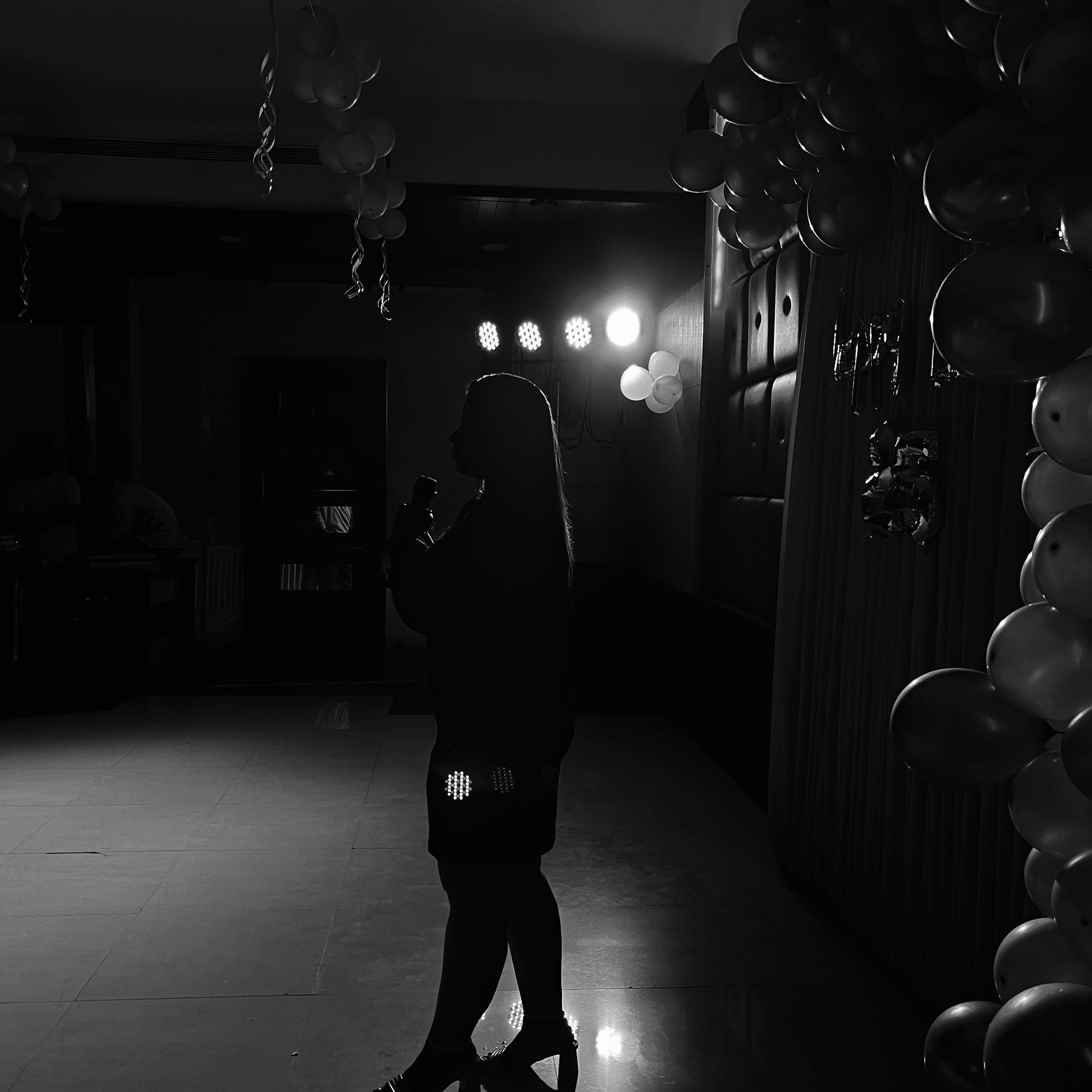 Female vocalist silhouette on stage