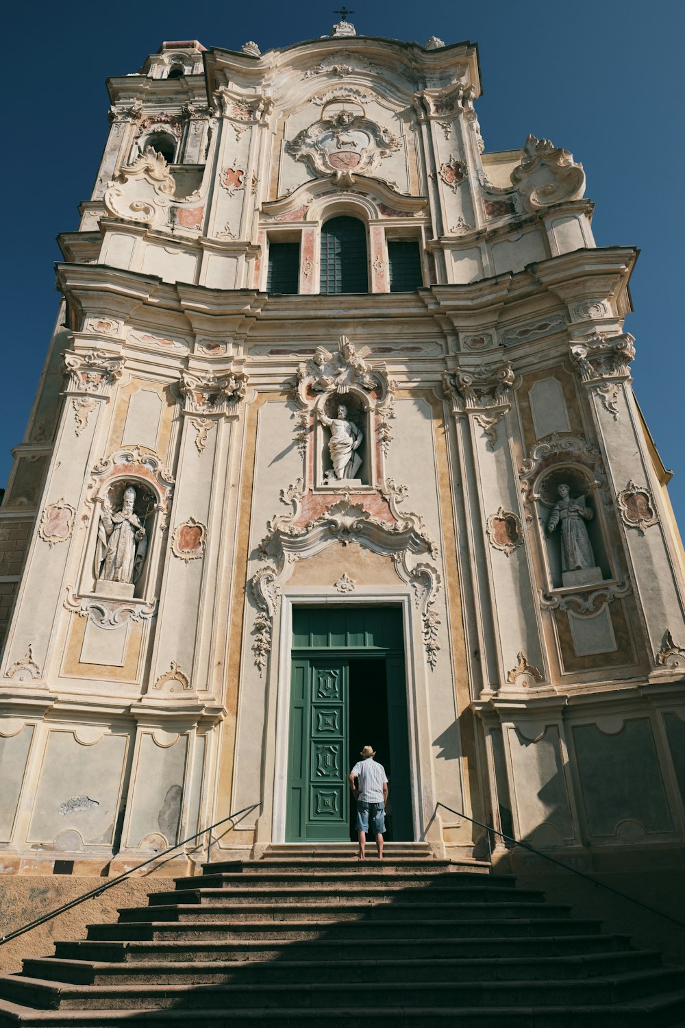 a man standing at the top of a set of stairs