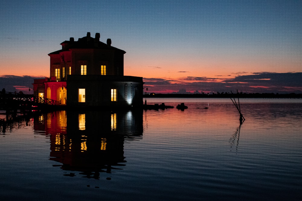 a house sitting on top of a body of water