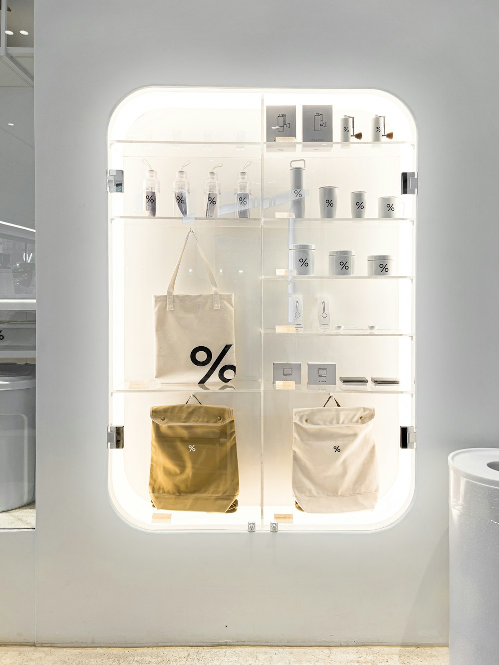 a display case in a store filled with bags