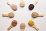 six different types of powdered spoons arranged in a circle