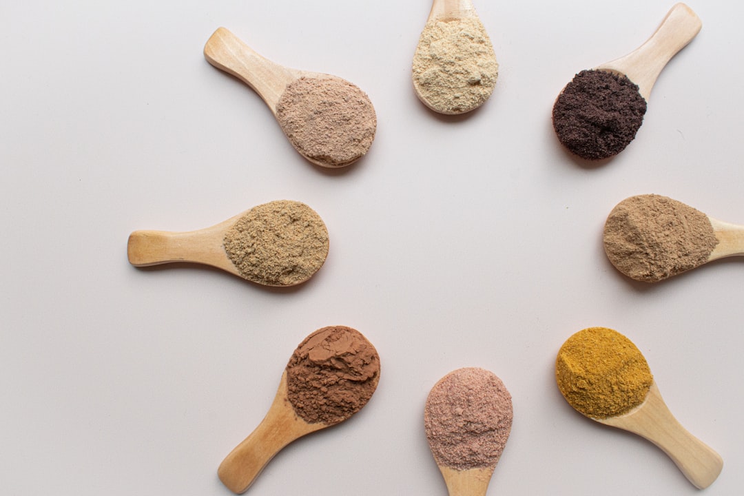 a group of spoons filled with different types of powder, Superfood powders