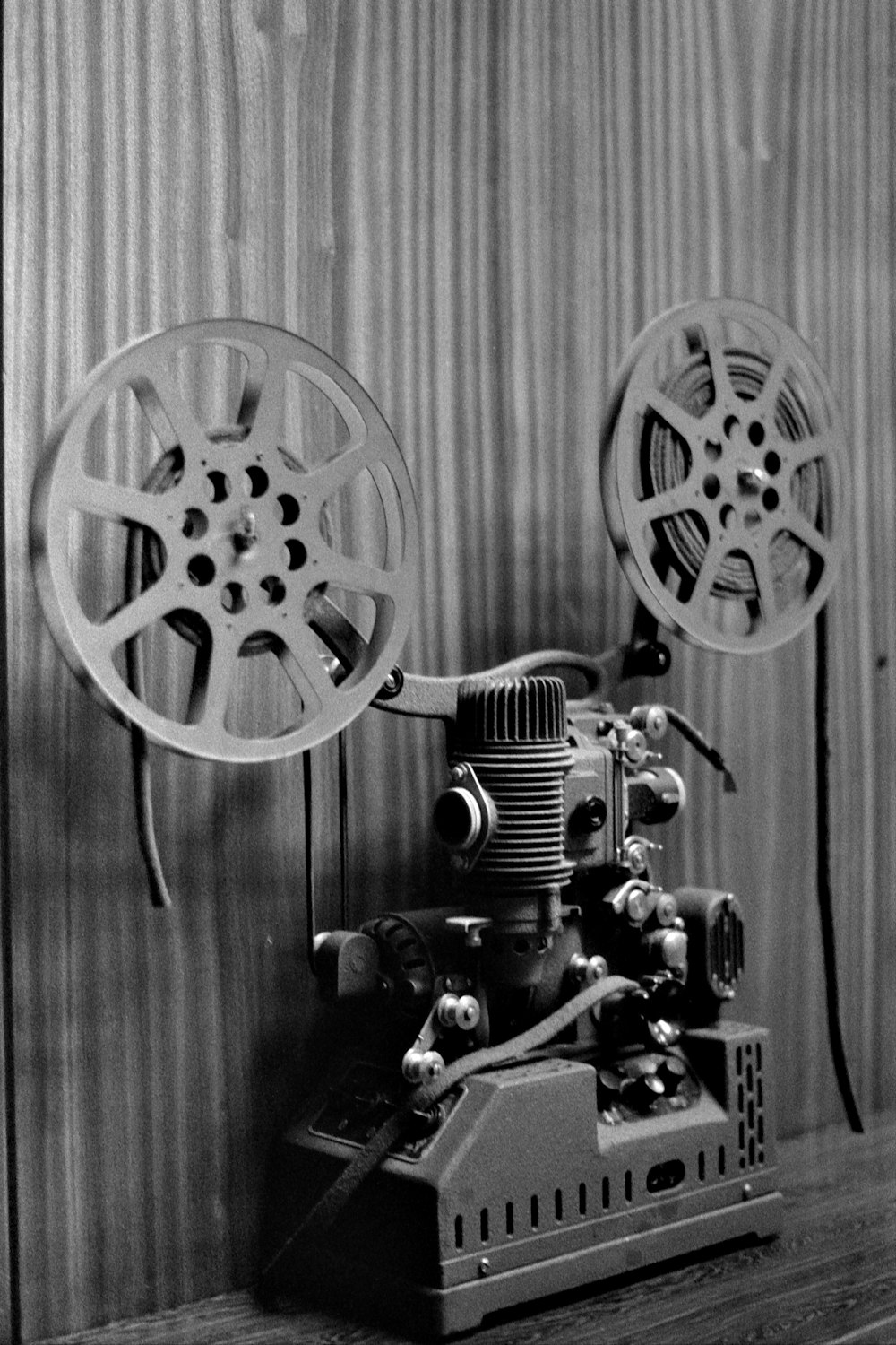 a black and white photo of a movie projector