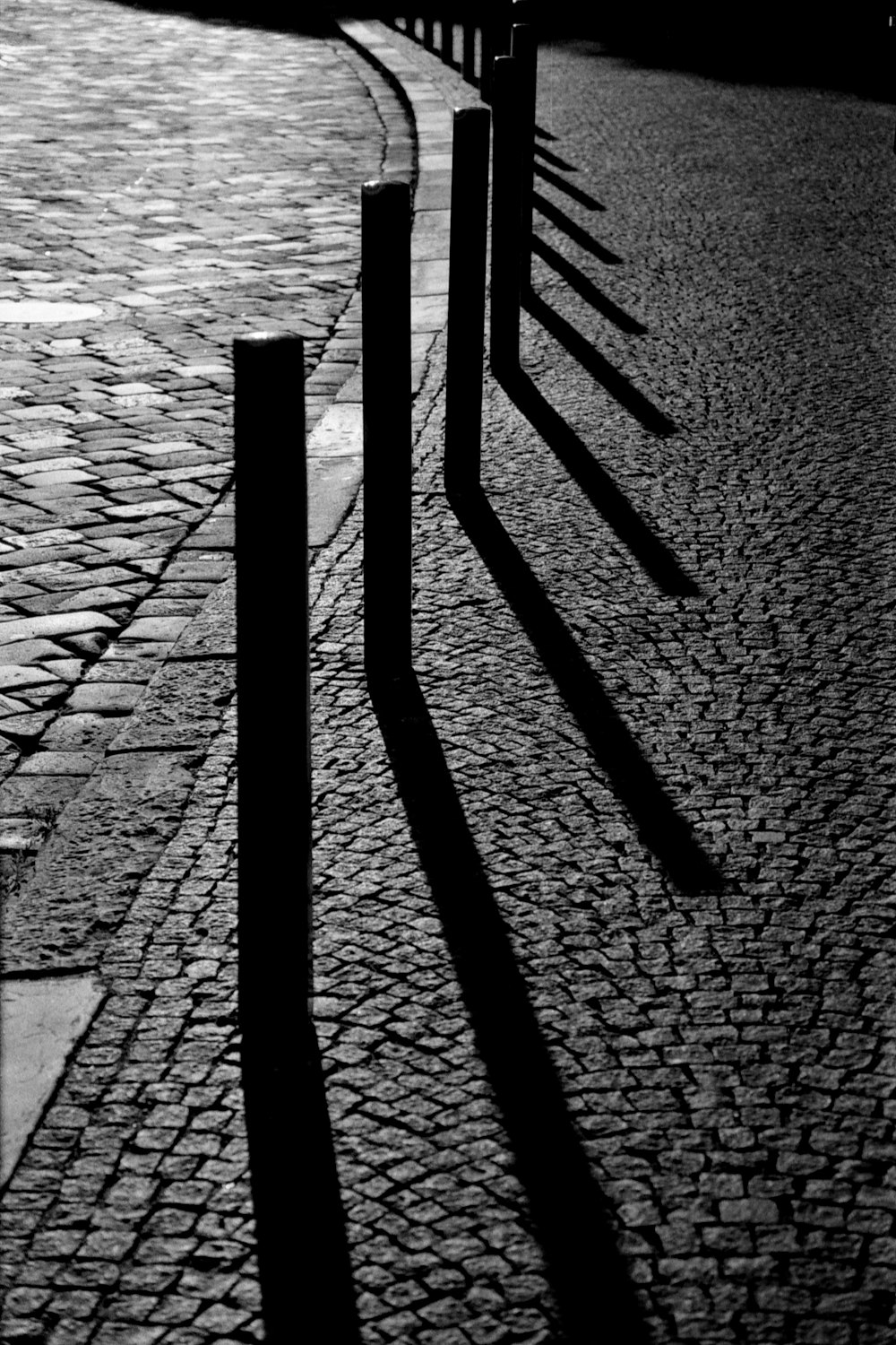 a black and white photo of a person walking down a street