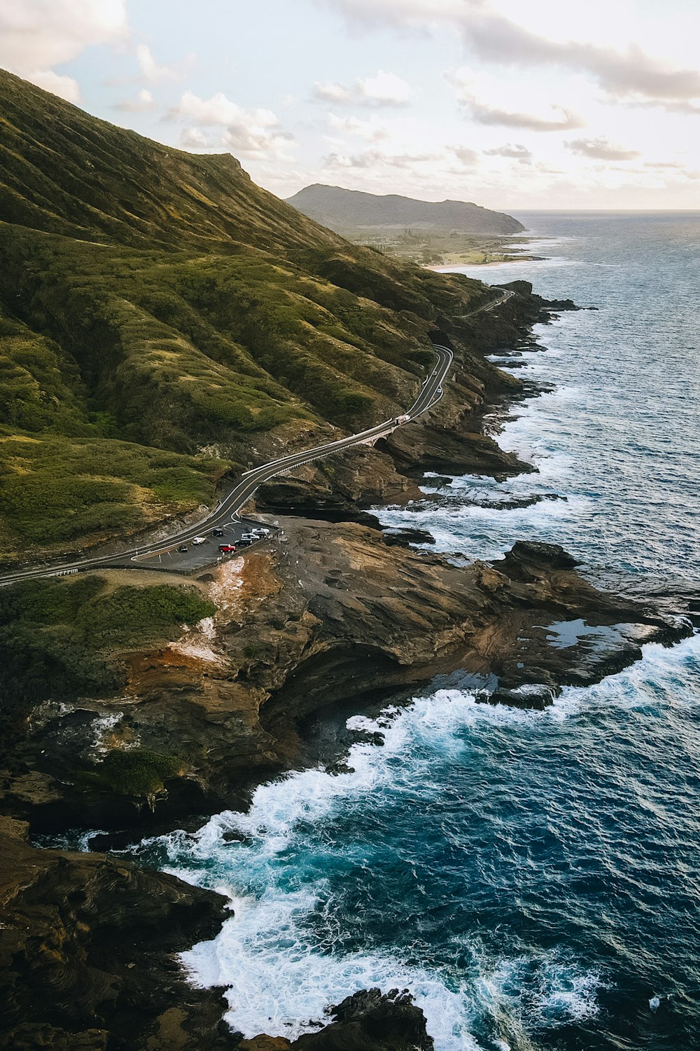 a scenic view of the ocean and a road