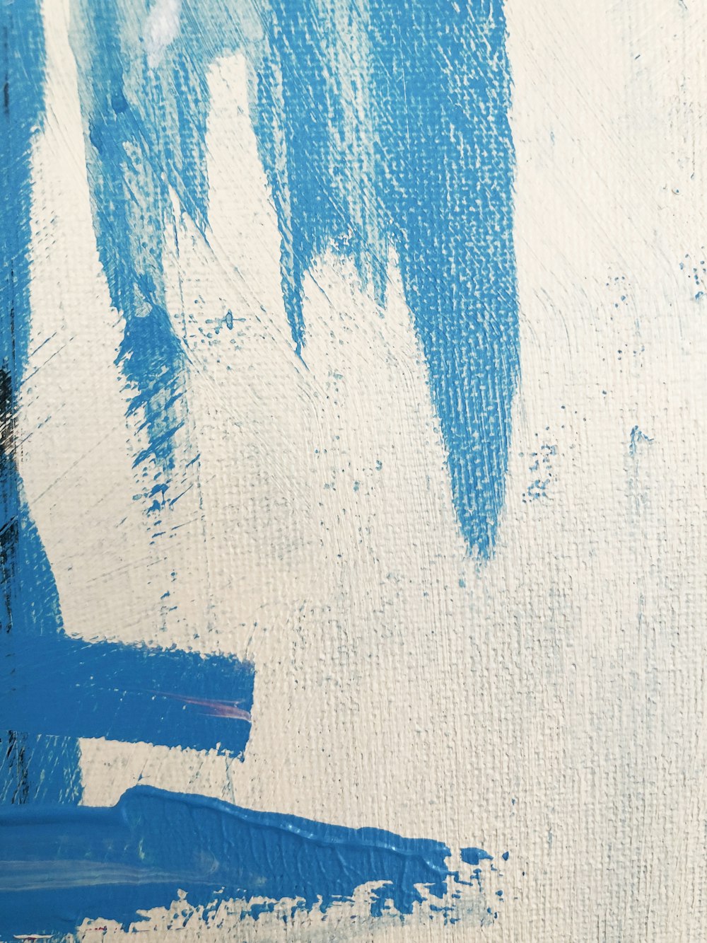 an abstract painting of blue and white colors