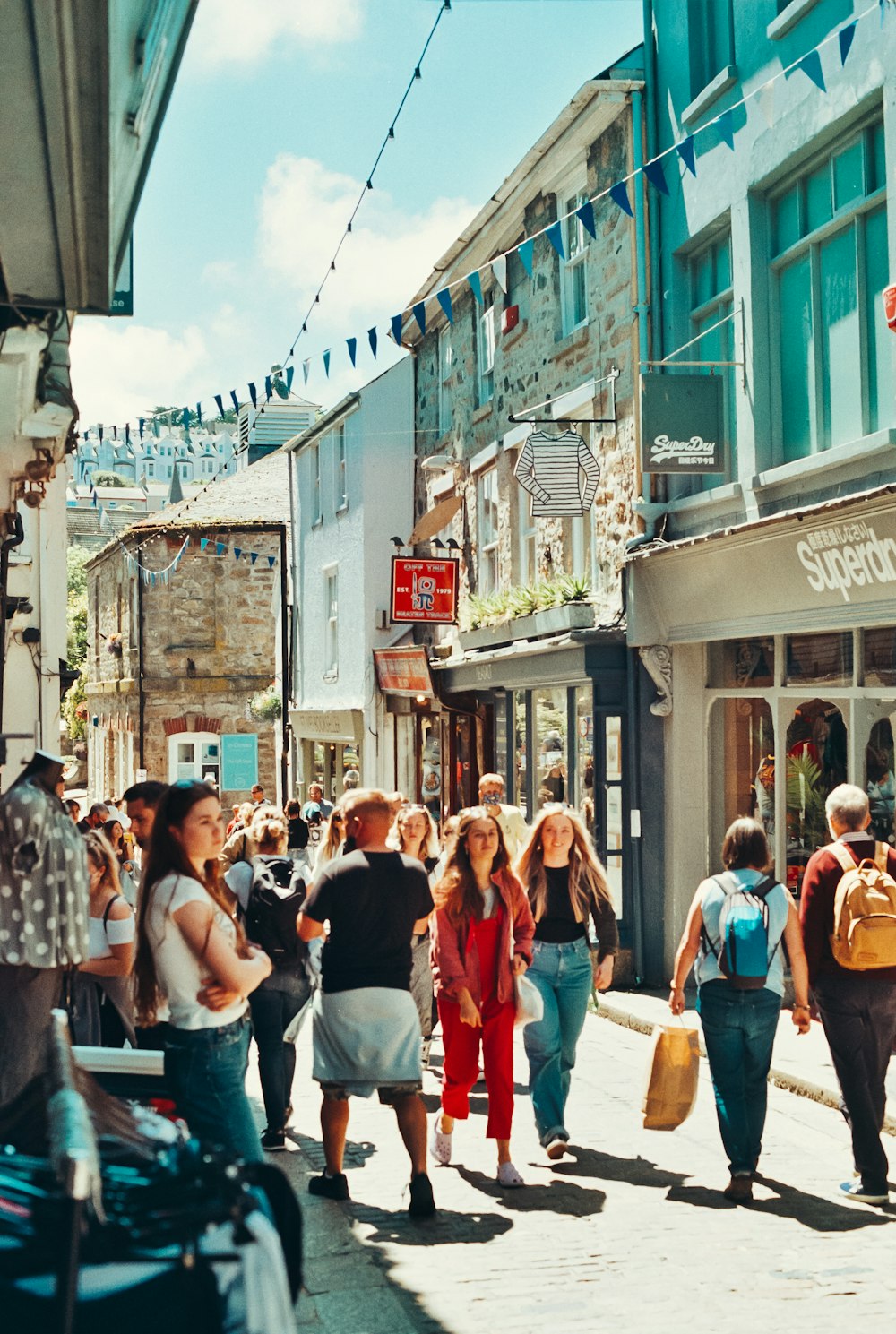 a group of people walking down a street