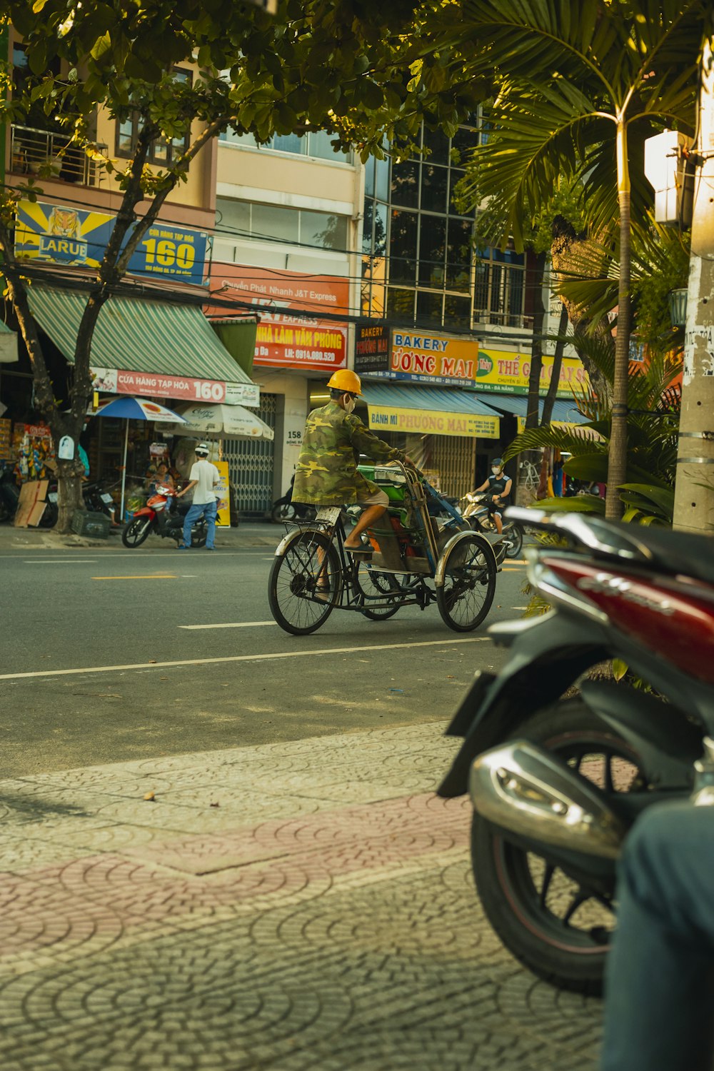 a man riding a motorcycle down a street