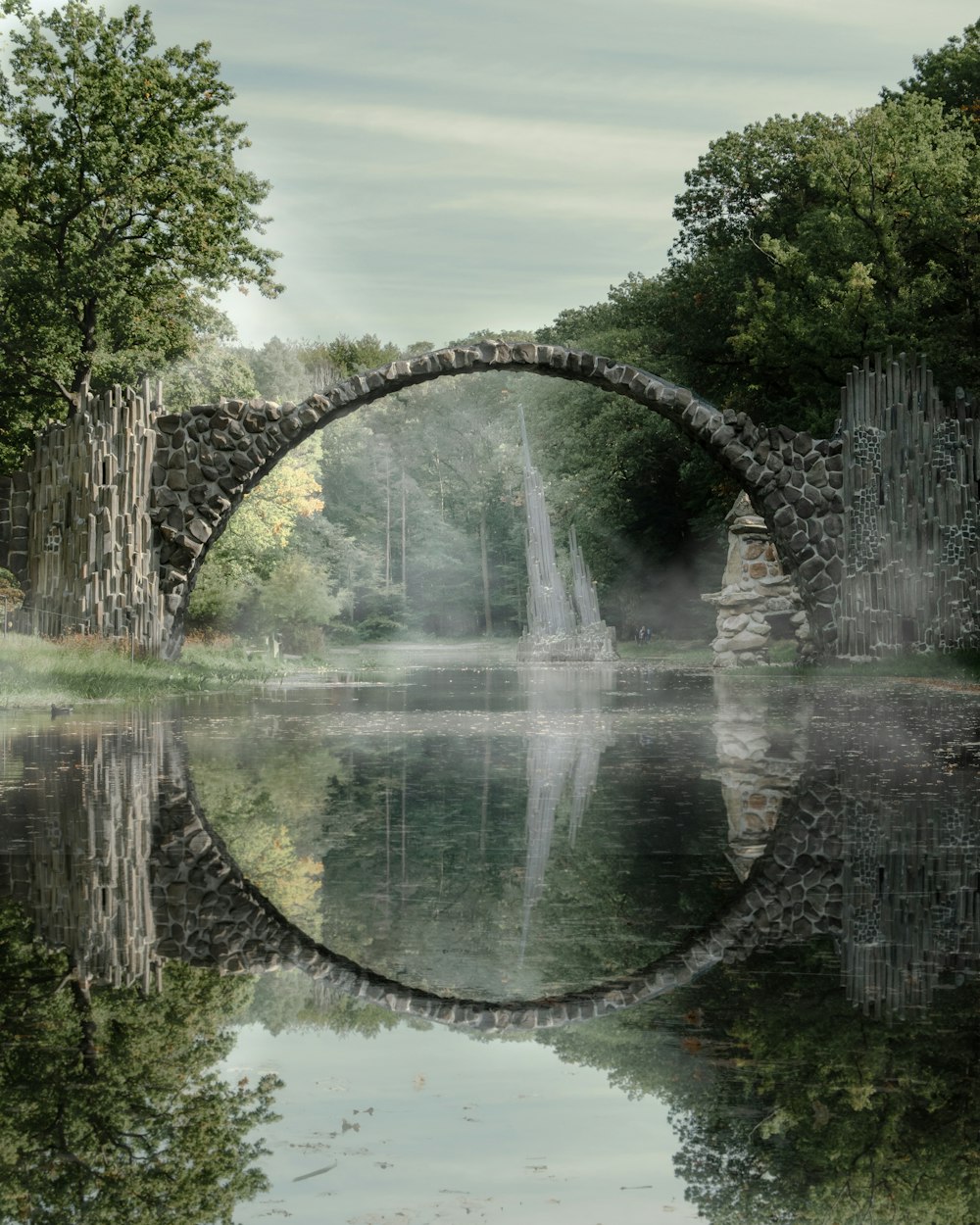 a stone bridge over a body of water