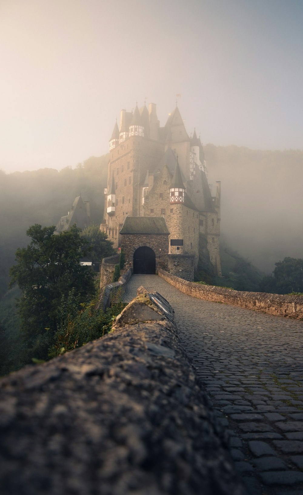 a castle with a stone walkway leading to it