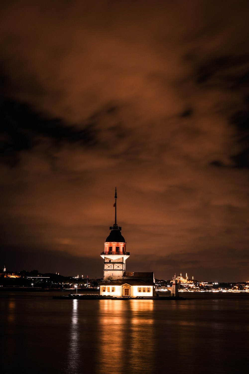 a clock tower is lit up at night