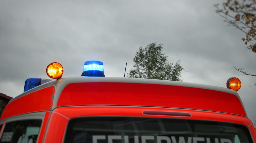 a red truck with two lights on top of it