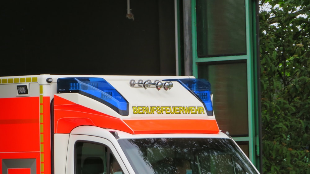 an ambulance parked in front of a building