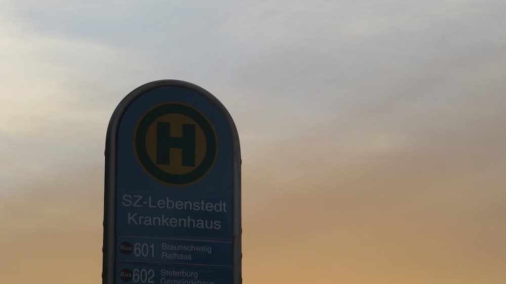 a street sign with a sky in the background