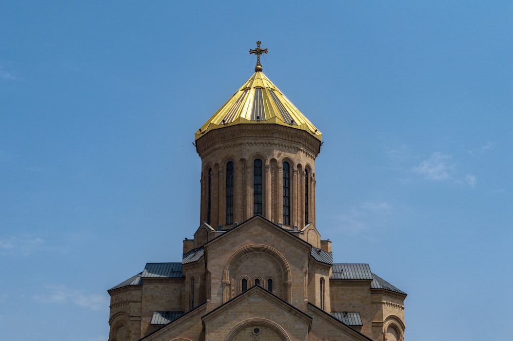 a church steeple with a cross on top