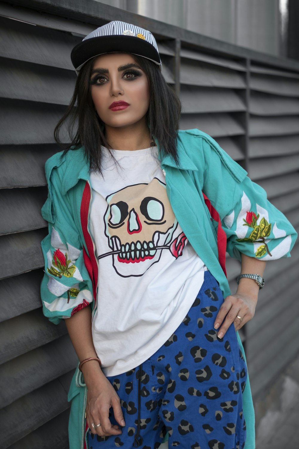 a woman wearing a shirt with a skull on it