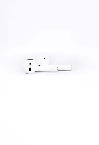 Wireless headphones with a minimalist design placed on a clean white surface.