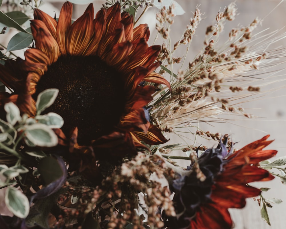 a vase filled with lots of different types of flowers