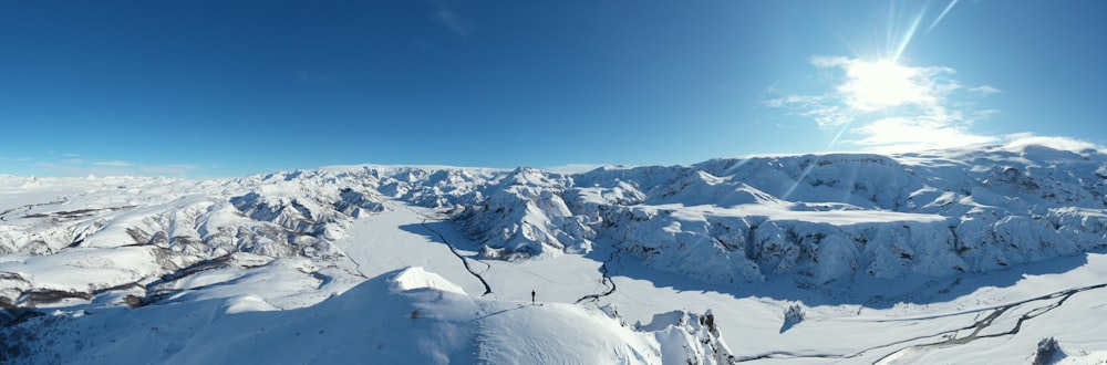 a view of a snowy mountain range from a helicopter