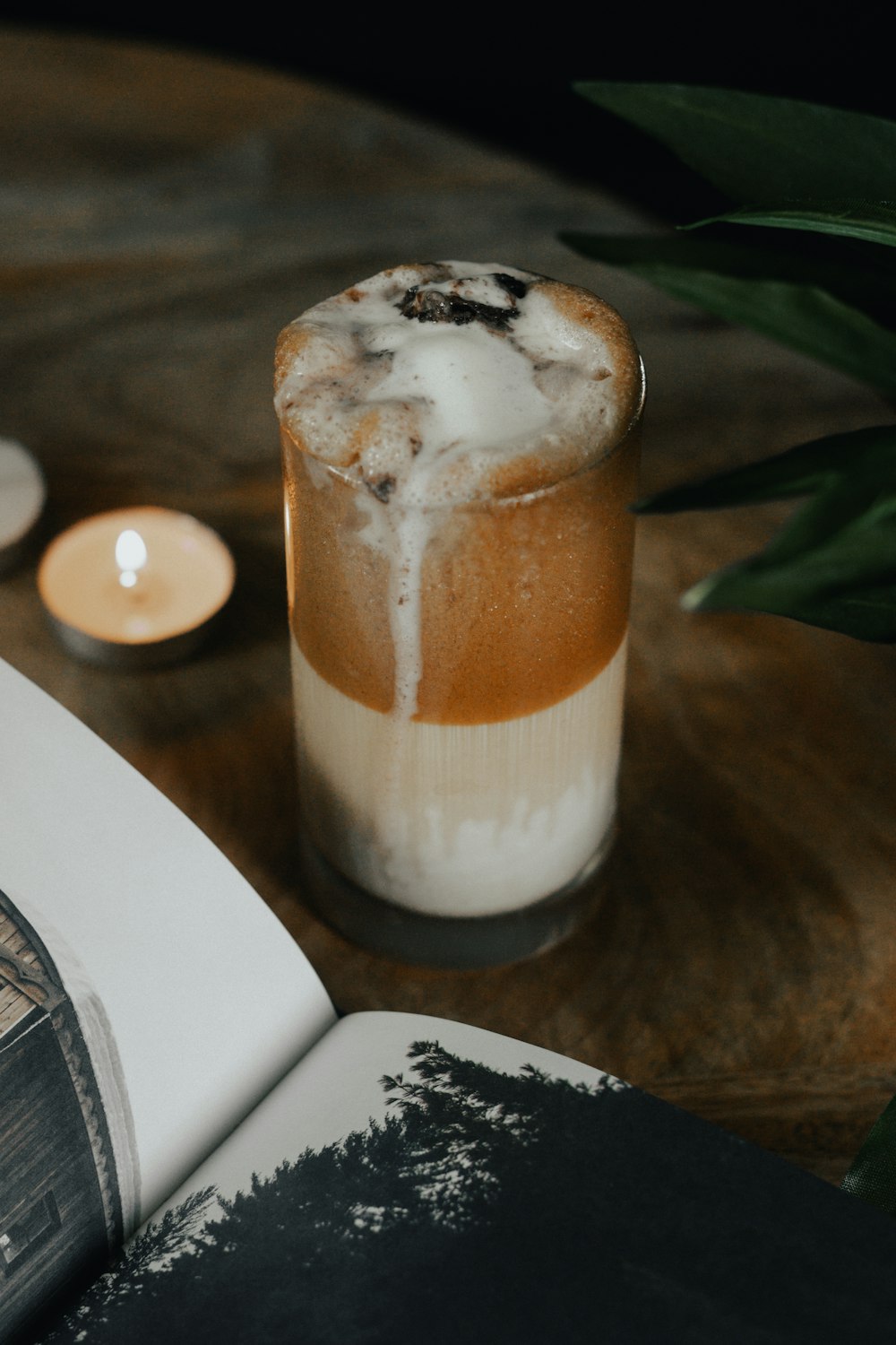 a book and a drink on a table