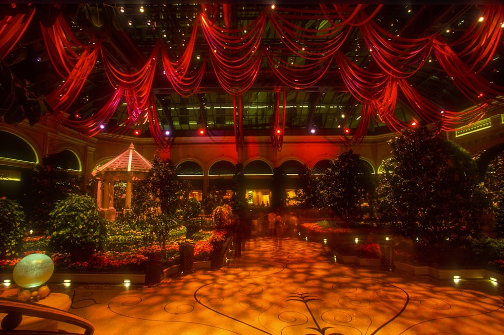 a large room with a lot of plants and lights