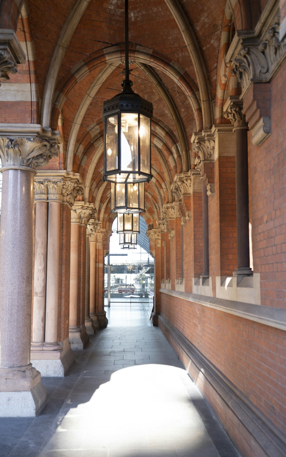 a long hallway with a light hanging from the ceiling