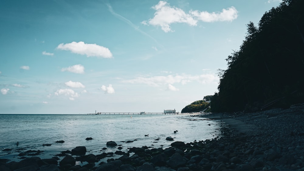 a view of a body of water with a bridge in the distance