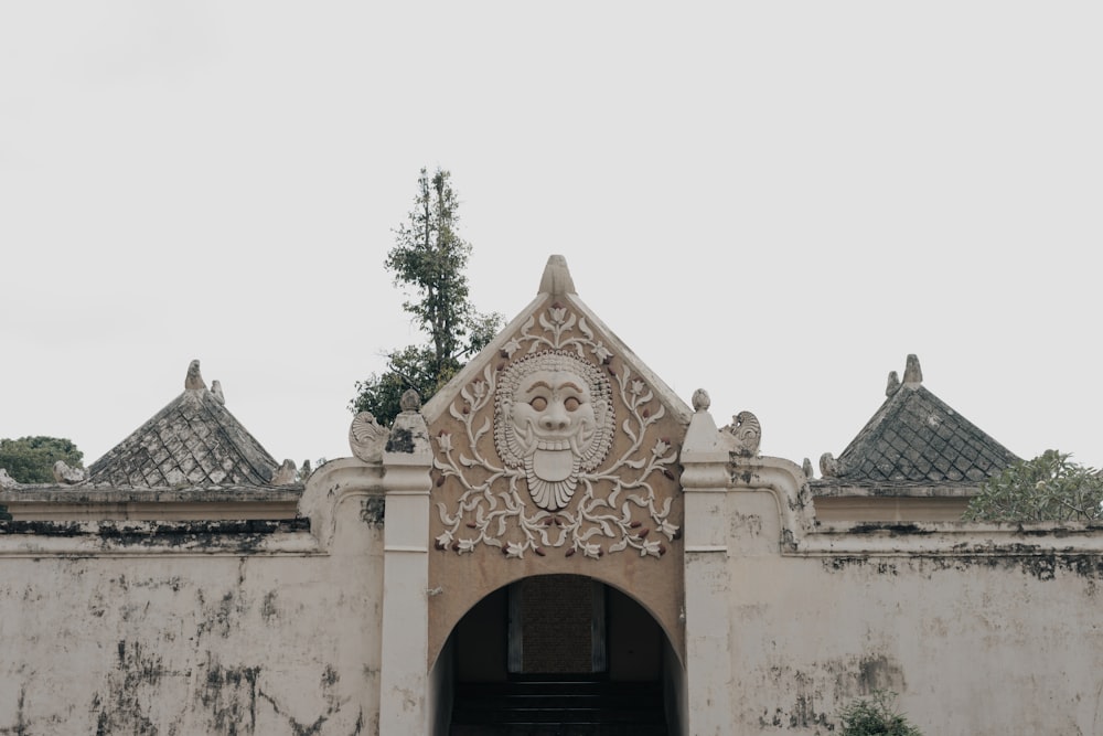 an old building with a carved owl on the front