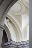 A beautifully crafted plaster arch showcasing intricate details.