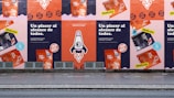 a row of posters on the side of a building