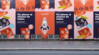 a row of posters on the side of a building